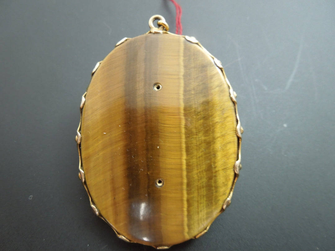 G403 Stunning 9 kt Yellow Gold Cameo on a Tiger's Eye Cabochon with .10 ct Dia