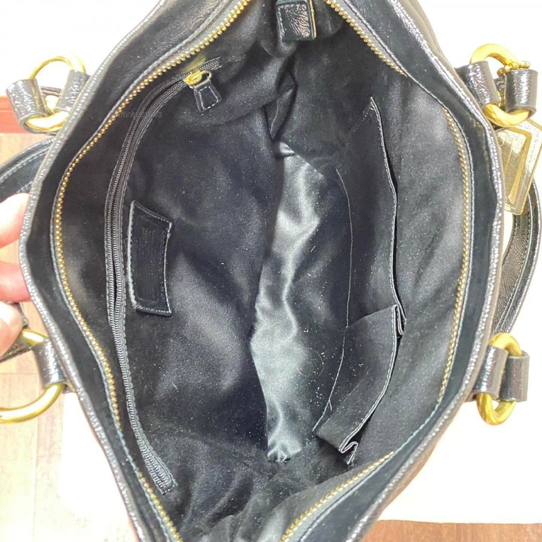 Buy the COACH F23401 Daisy Liquid Black Patent Leather Pocket