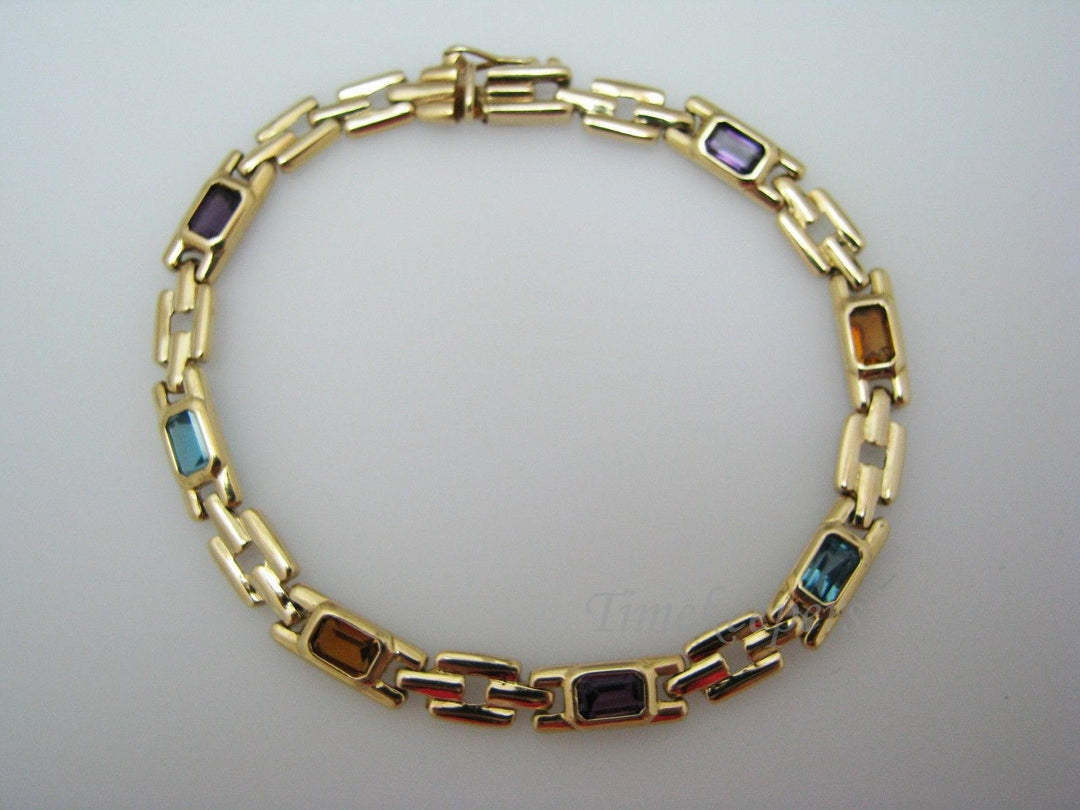a401 14k Yellow Gold Bracelet with Emerald Cut Gemstones