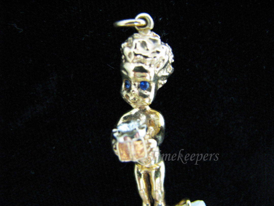 a740 Vintage 14k Yellow Gold Boy with Sapphire Eyes Holding a Present
