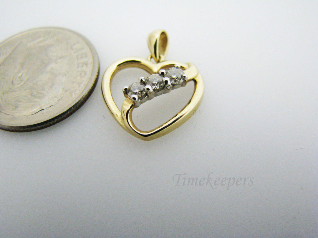 c130 Beautiful 10k Gold Heart Pendant with a Ribbon of 3 Diamonds Across