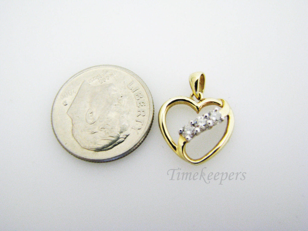 c130 Beautiful 10k Gold Heart Pendant with a Ribbon of 3 Diamonds Across