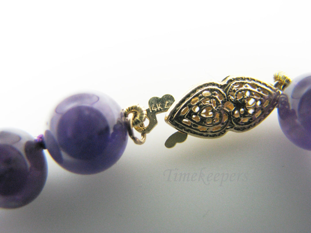 c037 Gorgeous Strand of Purple Beads with a Removable Heart Shaped Amethyst in 14k