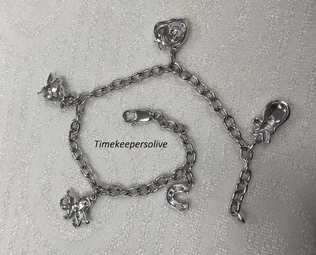 a160 Very Pretty 10k White Gold Bracelet with Charms and Diamonds tcw is .12