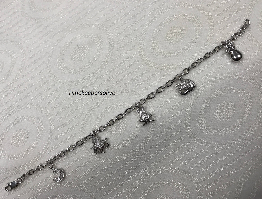 a160 Very Pretty 10k White Gold Bracelet with Charms and Diamonds tcw is .12
