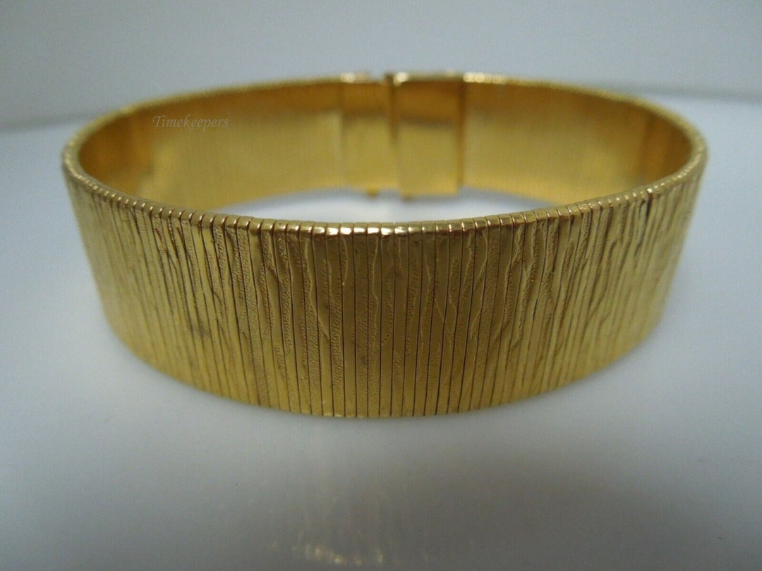 t031 Monet Gold Plated Wide Band Bracelet 7 1/2"